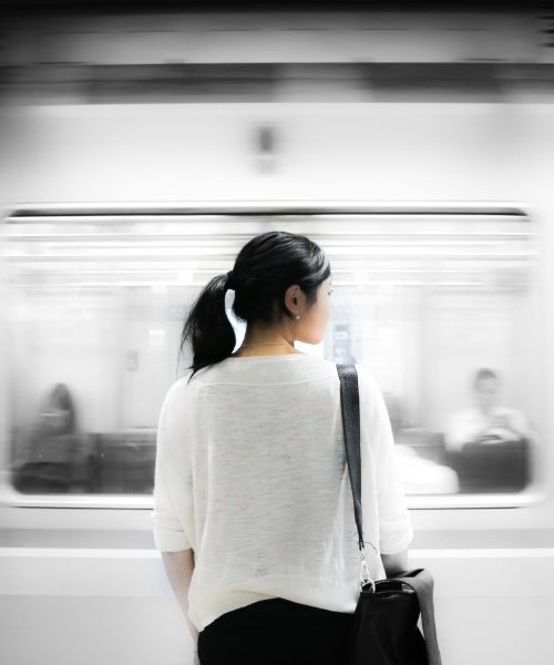 A girl, and a train passing